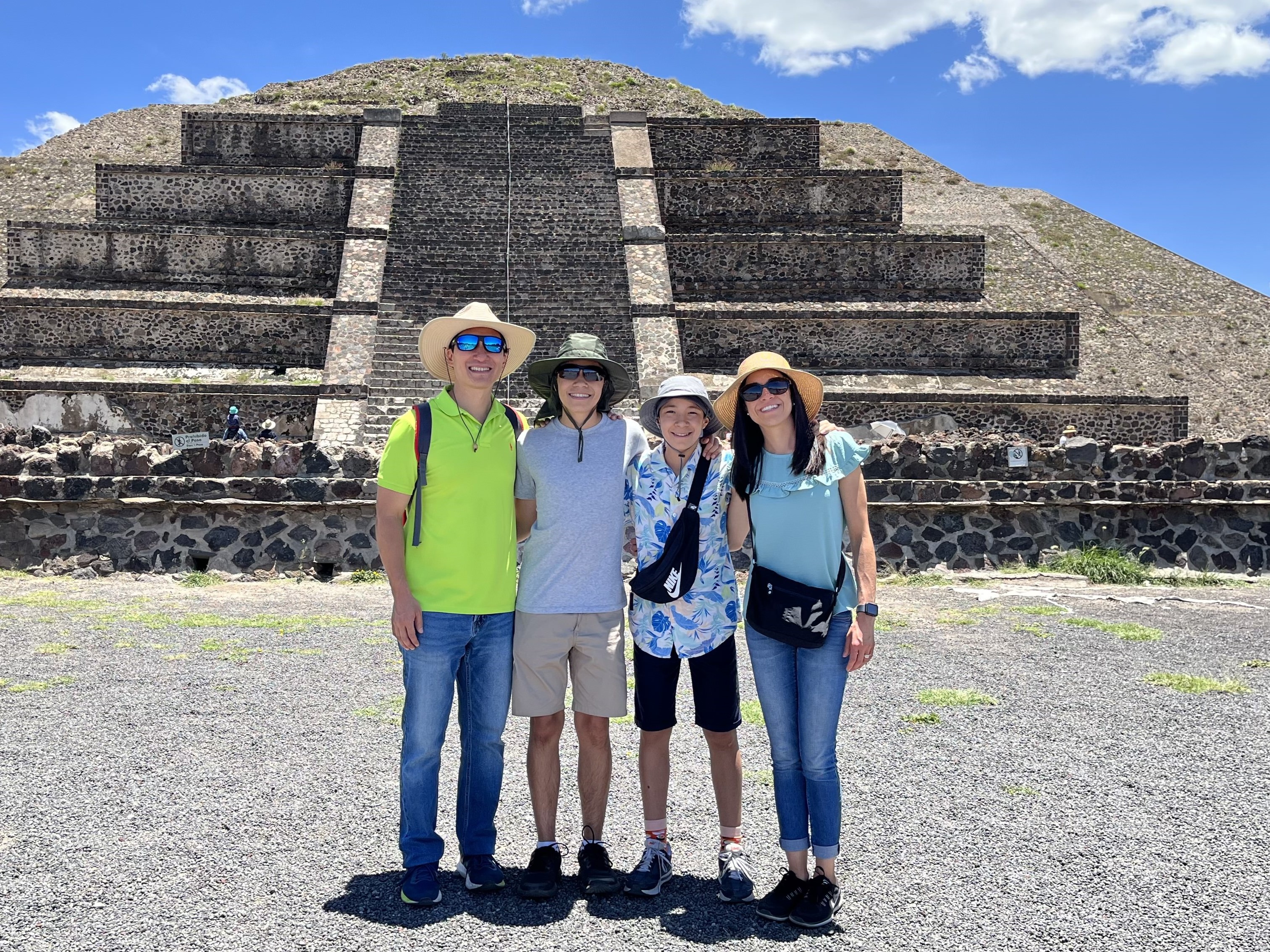 Nobuhiko and his family in front of a Mexican pyramid