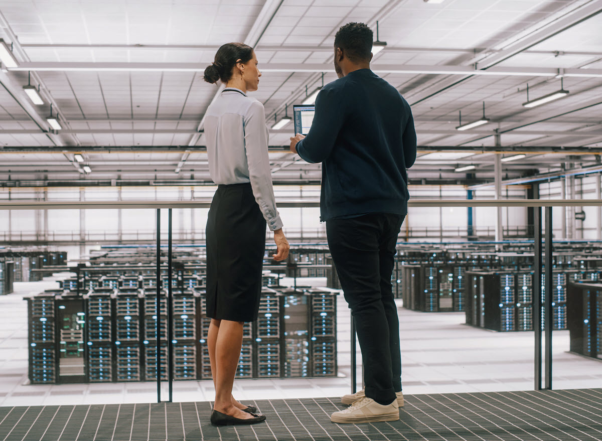 Man and woman looking at servers